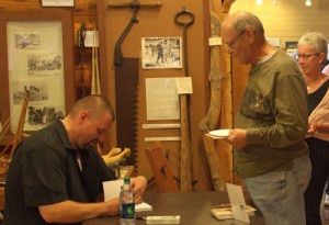 Signing "Sky Pilot of the Great Lakes" at the LCHA